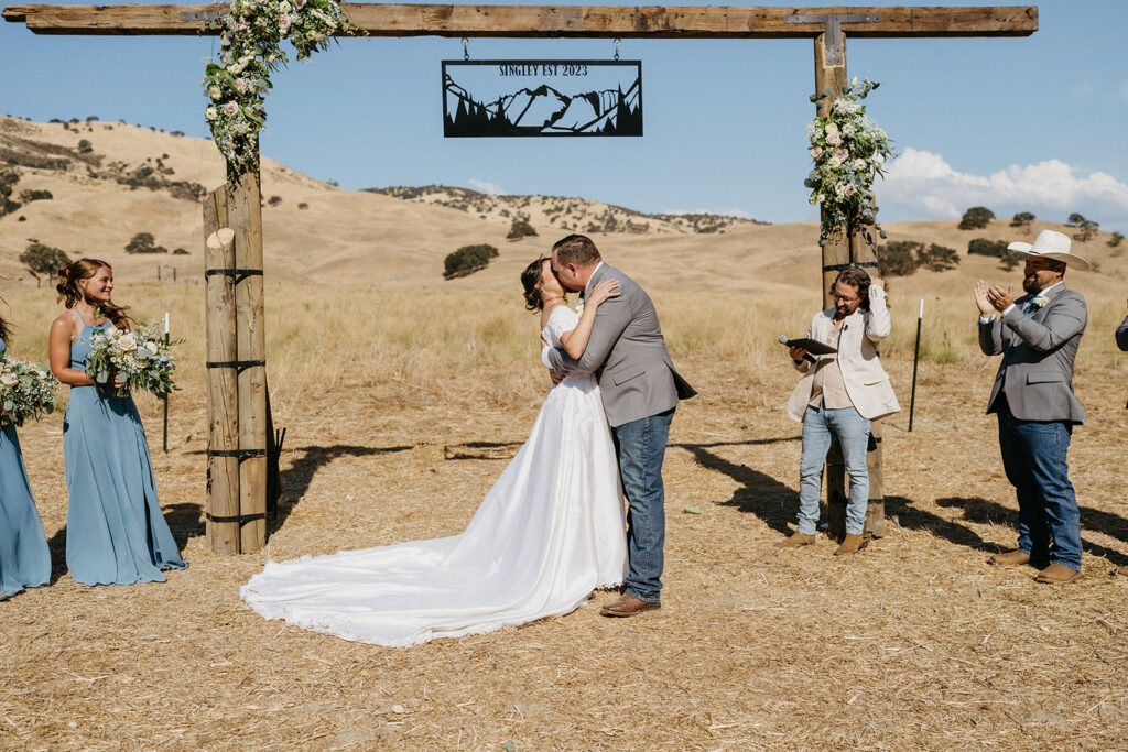 Rustic, country wedding ceremony at BarSZ Ranch in Paicines, California