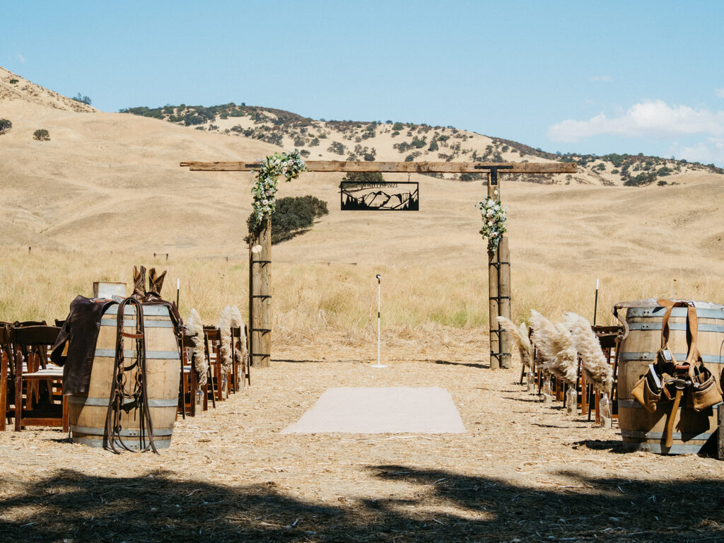 Rustic wedding ceremony decor at BarSZ Ranch in Paicines, California