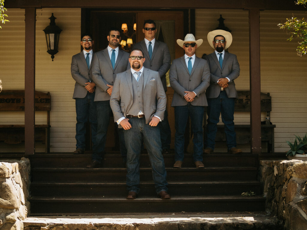 Groom and groomsmen in jeans and suit jacket for country wedding at BarSZ Ranch in Paicines, California