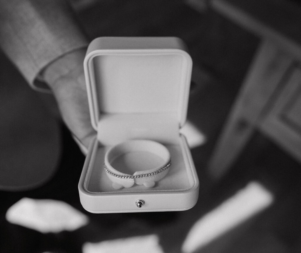 Close-up shot of a diamond-encrusted bridal bracelet inside its box, captured during wedding preparations at Tahoe Mountain Club.